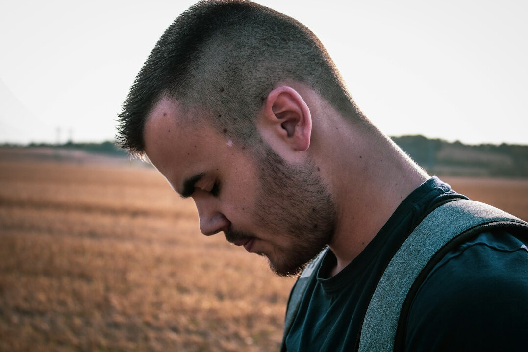 Portrait of a man with short hair and light stubble